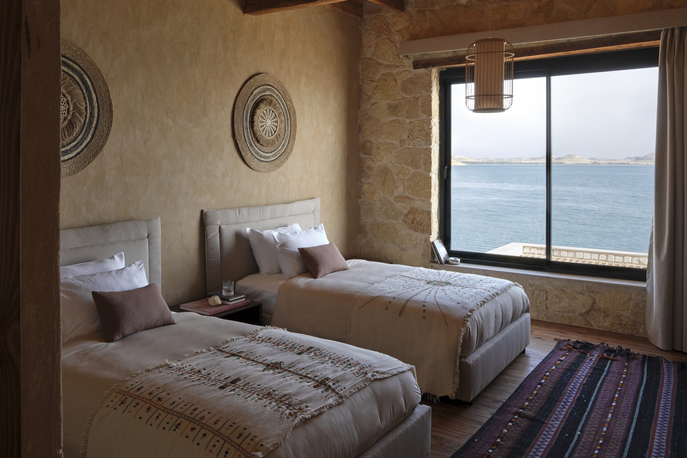 Twin room with medallions and lake window